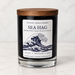 Sea Hag 9 oz soy candle by Rockport Candle Company in a black glass jar with wooden lid, scented with sea salt, driftwood, and musk